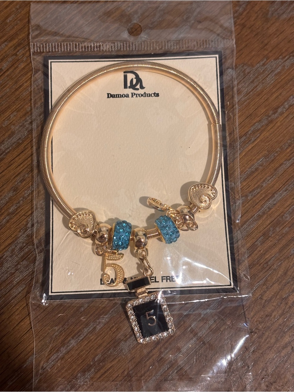 Gold-Tone Charm Bracelet with Blue Crystal Accents and Number 5 Pendant